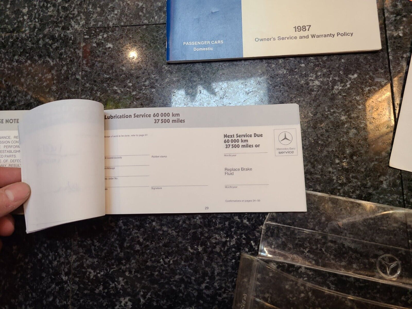 1987 Mercedes 560SL owners manual set maintenance booklet holder etc r107 oem